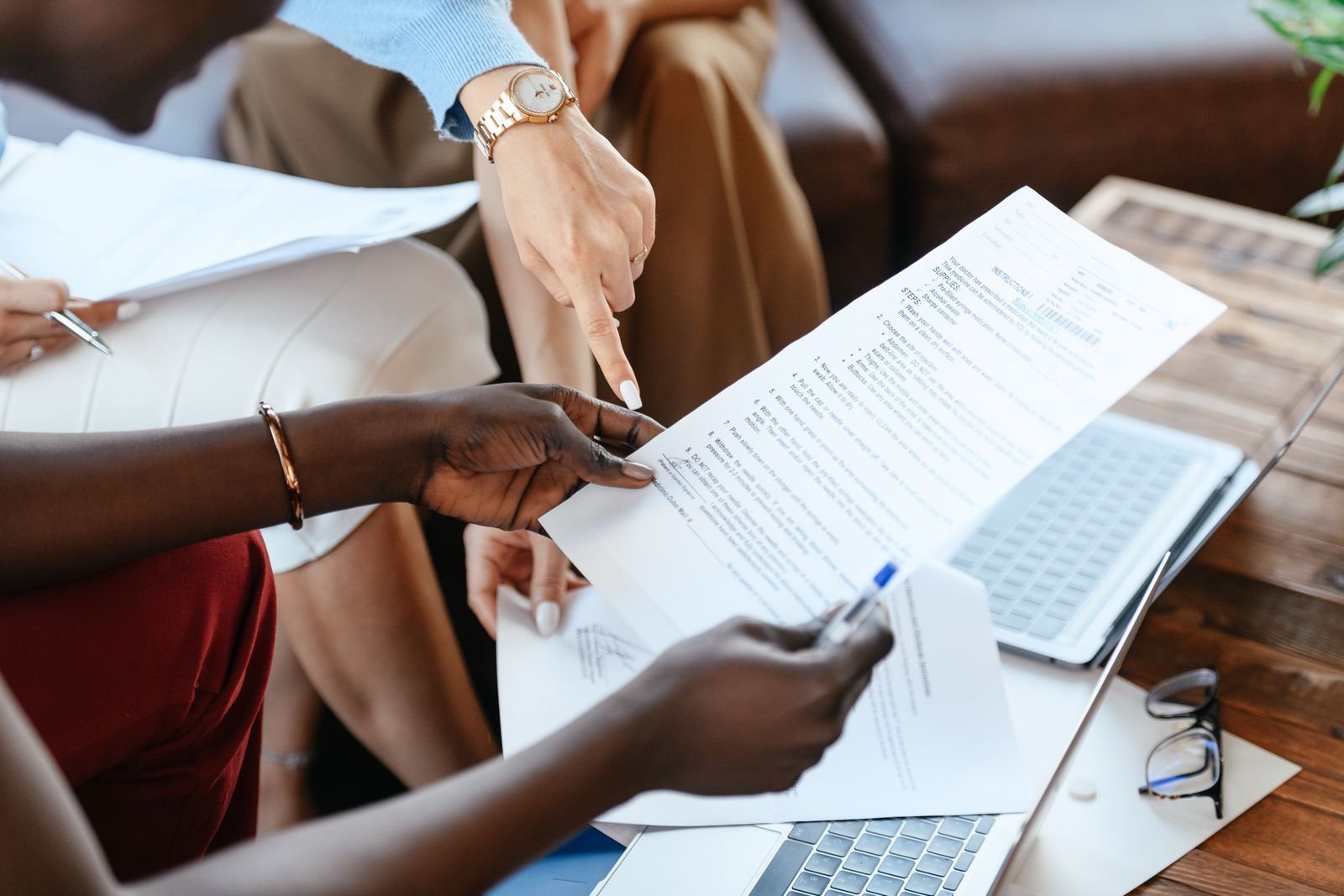Overhead view of colleagues reviewing documents at a table